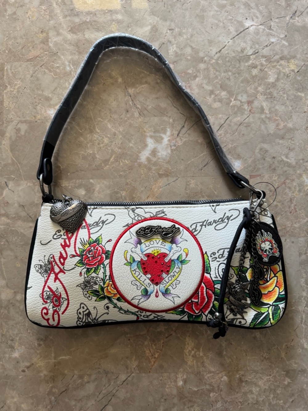Ed Hardy White shoulder bag with colorful design.